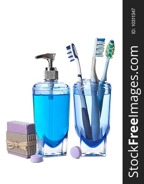 Soap and toothbrushes isolated over white