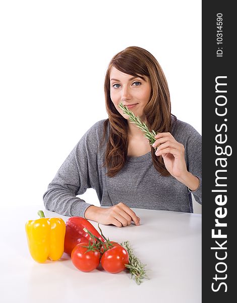 Woman smell herb in a modern kitchen