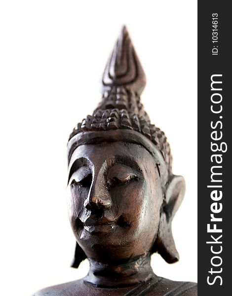 Portrait of Buddha statue varved out of wood