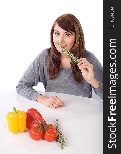 Woman smell herb in a modern kitchen