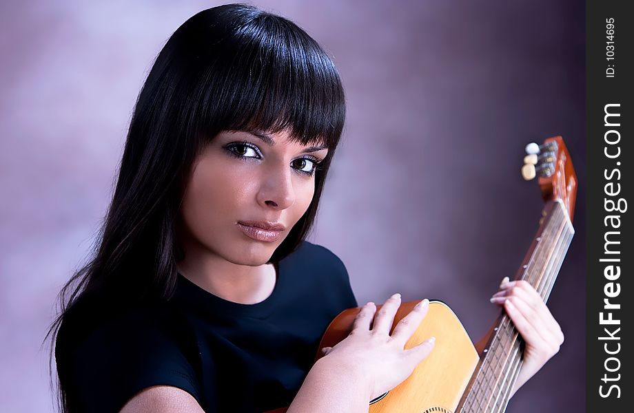 Beautiful Woman are Playing Guitar, studio shot. Beautiful Woman are Playing Guitar, studio shot