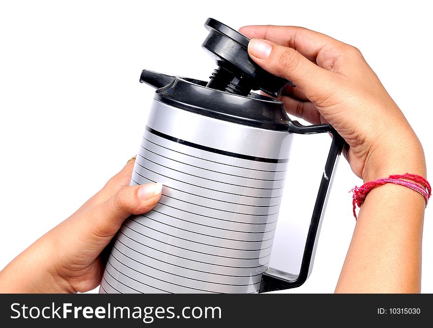 Female hands putting  the kettle lid. Female hands putting  the kettle lid.