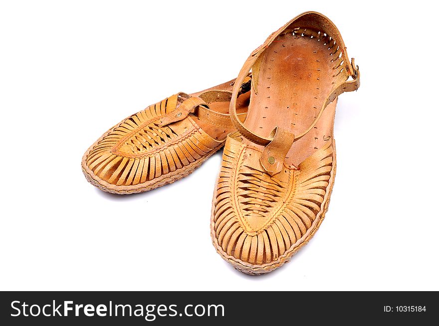 Hand crafted leather footwear isolated on white background.