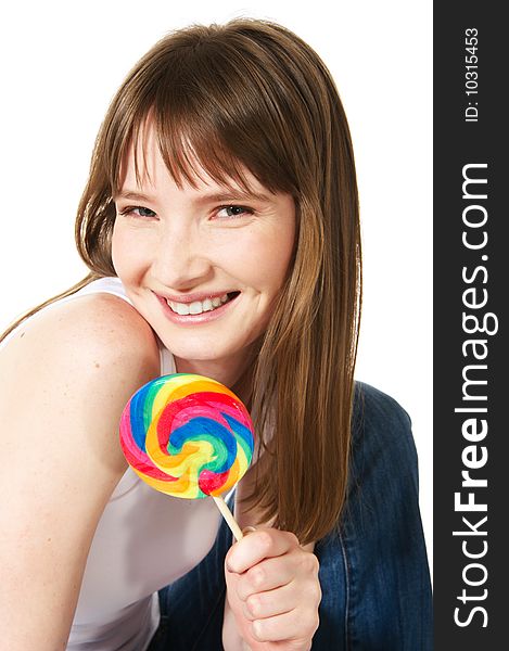 Portrait of teenage girl holding big lollipop