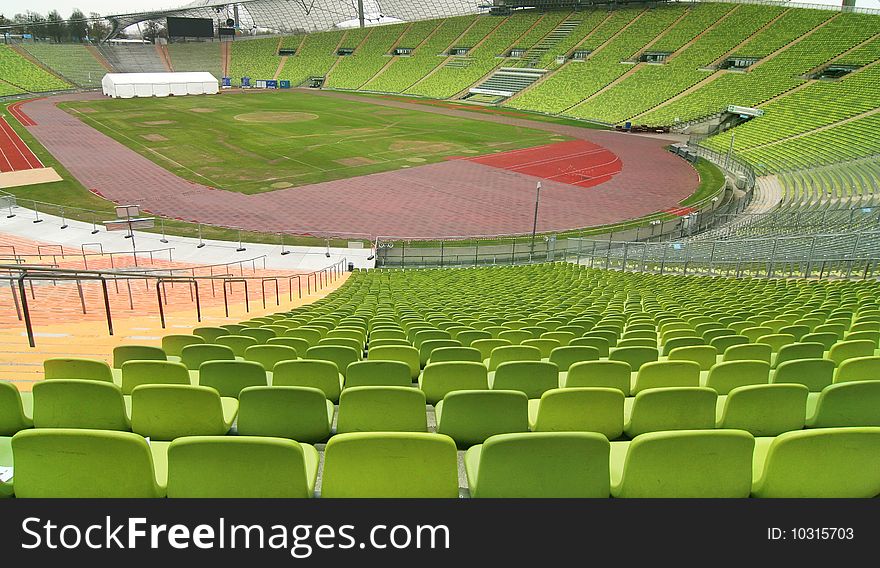 Panoramic view of an empty stadium with green seats. Panoramic view of an empty stadium with green seats.