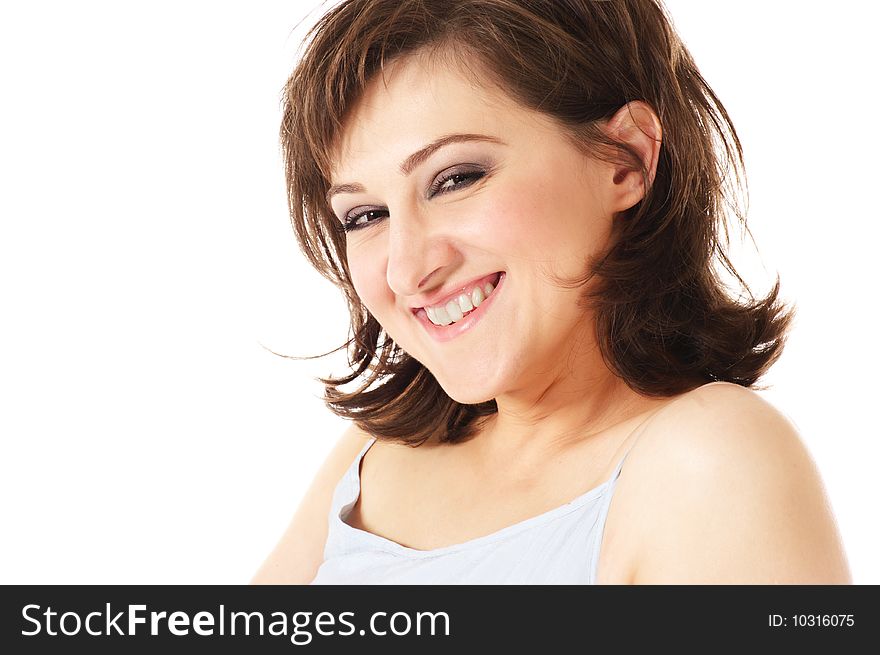 Laughing young woman with brown curly hair