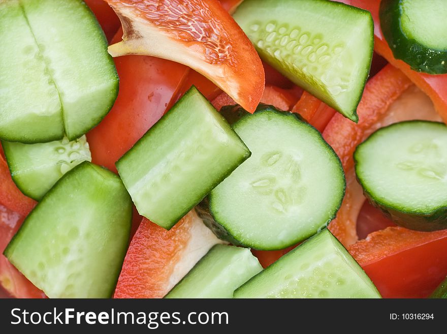 Diced fresh cucumbers and peppers, closeup