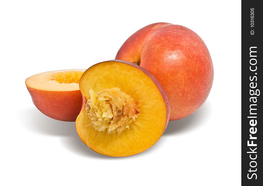 Ripe nectarines closeup, isolated on white