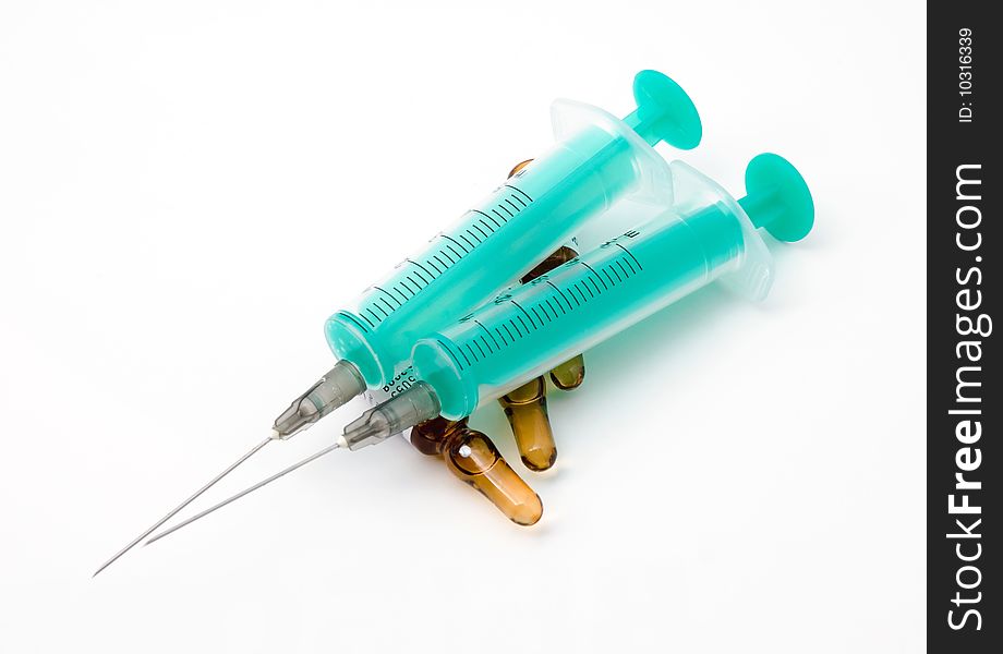 Two disposable syringe in ampoules with medicine. Two disposable syringe in ampoules with medicine