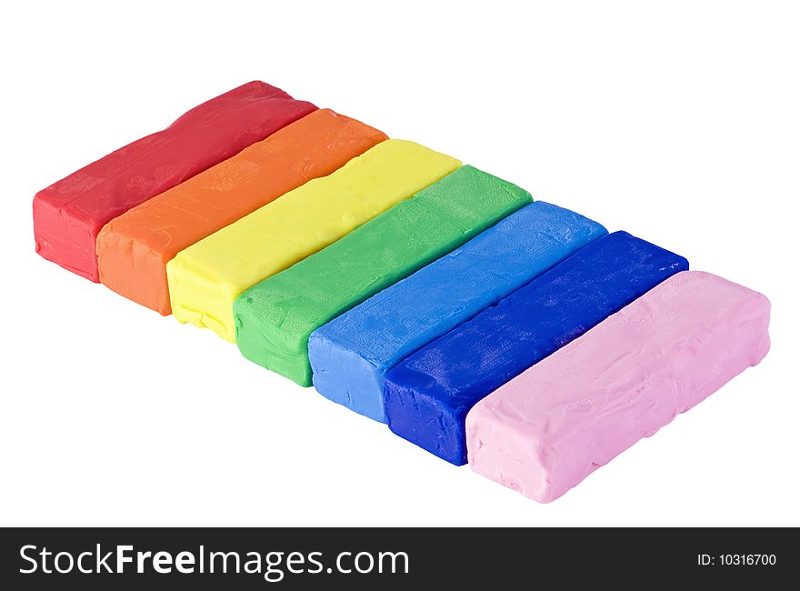 Rainbow of colorful pieces of plasticine isolated. Rainbow of colorful pieces of plasticine isolated