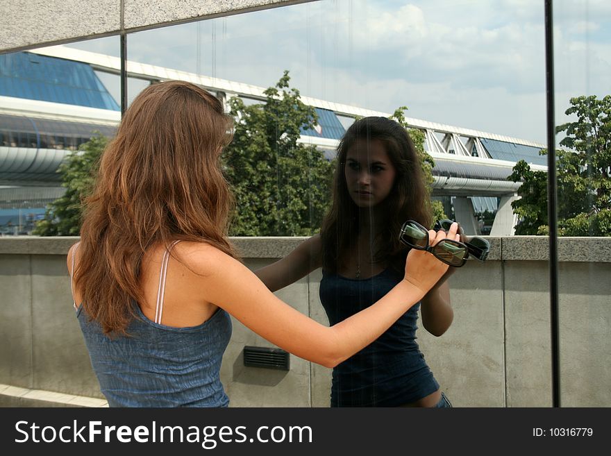 Girl Looking At Her Reflection