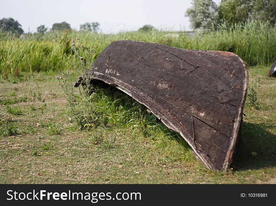 Abandoned boat upside down in Danube Delta