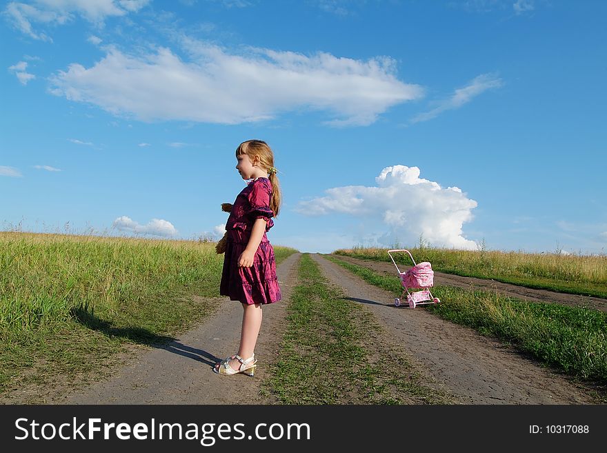 The lonely girl on a farmer field