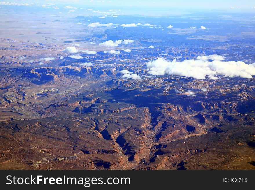 Clouds over rocky mountains plains landscape