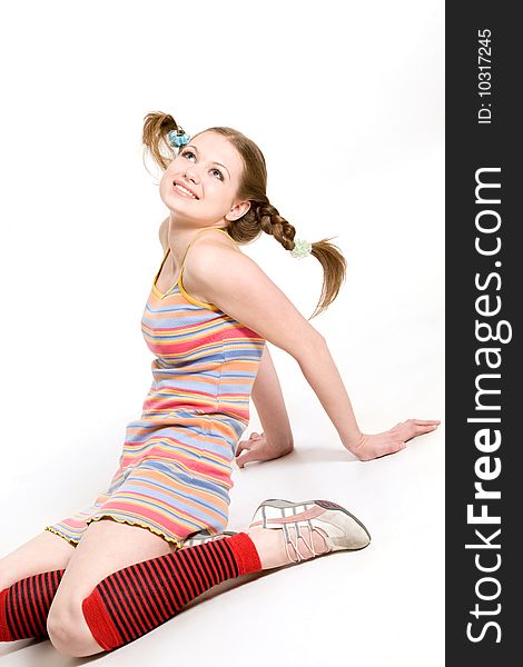 model with pigtails dressed rainbow striped short dress