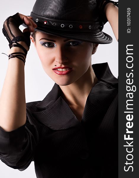 Young fashionable model with black hat