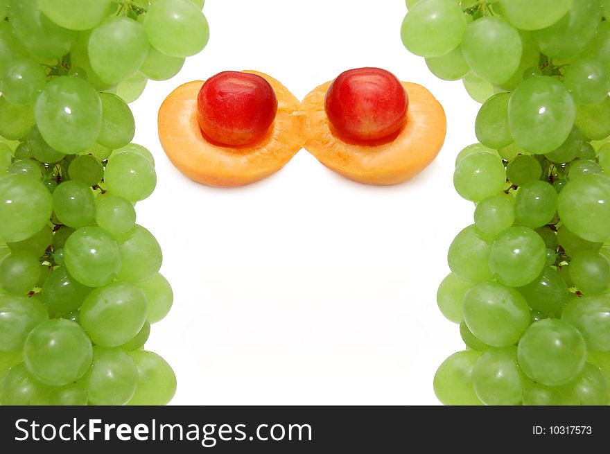 Apricot and sweet cherry in a framework from grapes