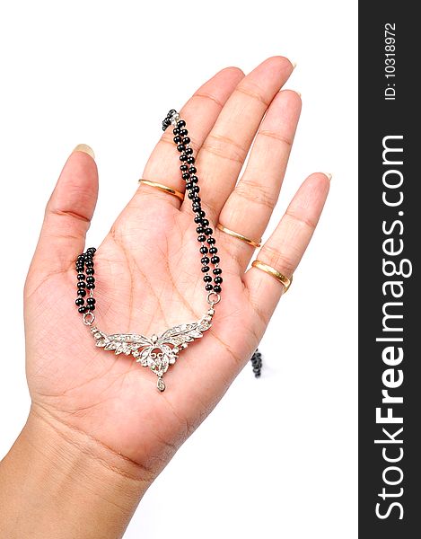 Diamond pendant jewellery in female's hand.