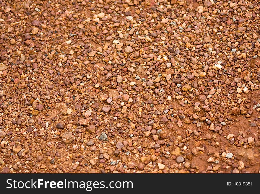 Close-up of red gravel background texture. Close-up of red gravel background texture