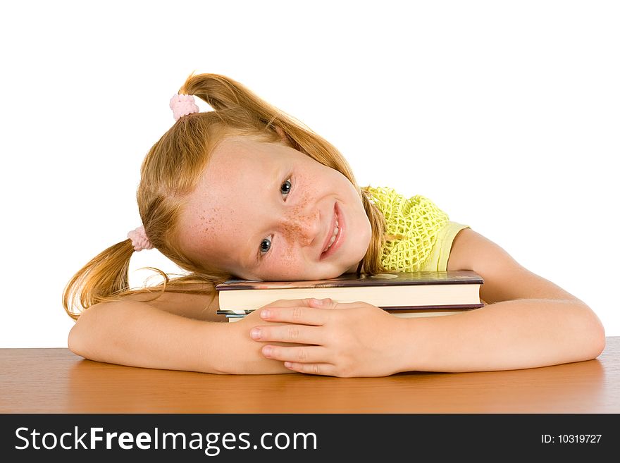 Smiling girl resting his head on books. Smiling girl resting his head on books