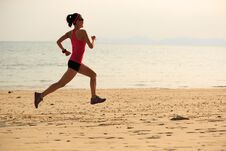 Sporty Woman Runner Running On Seaside Sandy Beach Stock Photos