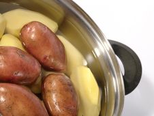 Fresh Raw Potatoes Into The Steel Pan. Royalty Free Stock Photos Fresh Raw Potatoes Into The Steel Pan. Royalty Free Stock Photos