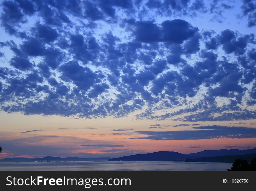 Colorful sky scene at sunset above sea. Colorful sky scene at sunset above sea