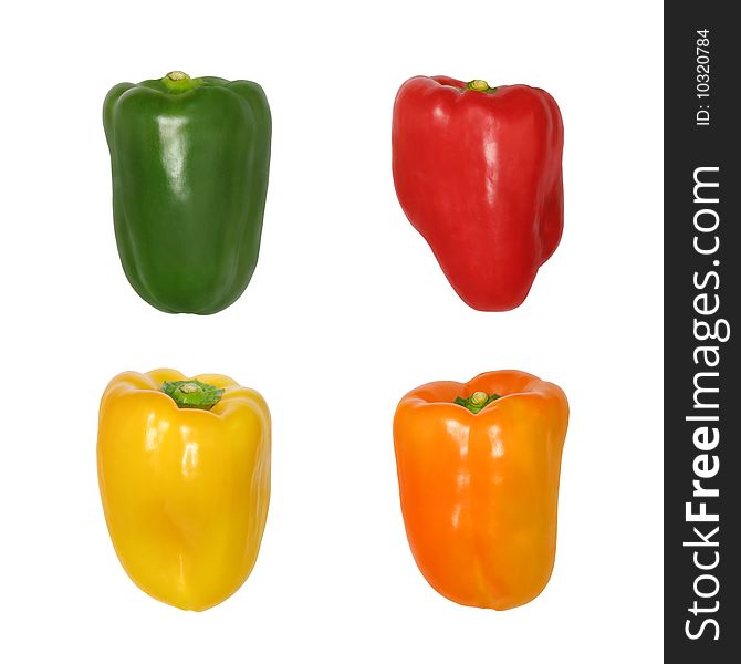 Peppers in the colors of green, red, orange and yellow, isolated over white background. Peppers in the colors of green, red, orange and yellow, isolated over white background.