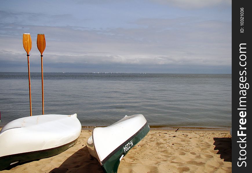 Wooden rowers and boats on shore