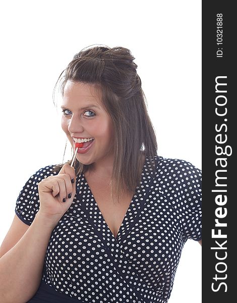 Young cheeky woman with lollipop; isolated on a white background