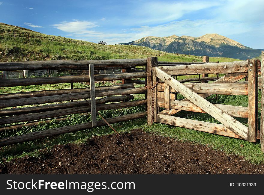 Ranch rural of weathered wooden fence in the mountains in the summer. Ranch rural of weathered wooden fence in the mountains in the summer.