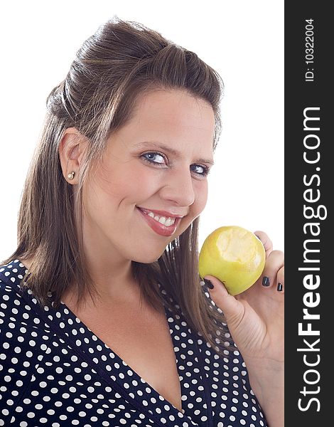 Young smiling woman holding a golden delicious apple with a bite taken out of it; isolated on a white background. Young smiling woman holding a golden delicious apple with a bite taken out of it; isolated on a white background.