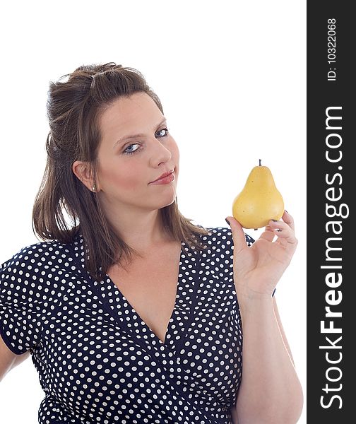 Young woman holds a pear on display in her hand; isolated on a white background. Young woman holds a pear on display in her hand; isolated on a white background.