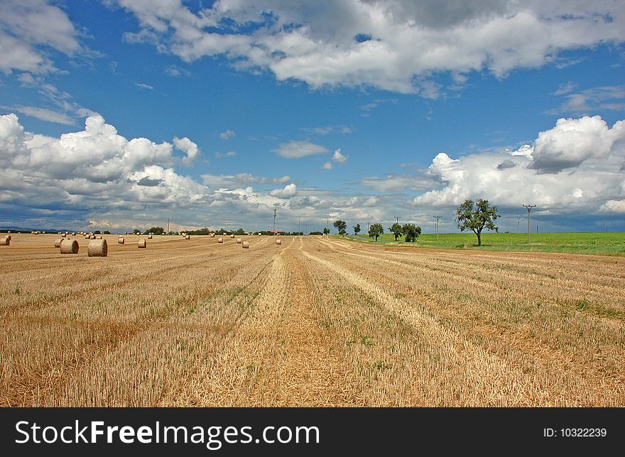 View on fields after harvest with a beautiful summer sky. View on fields after harvest with a beautiful summer sky