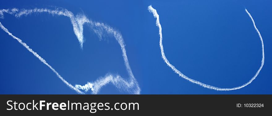 Love you clouds made by a small airplane in the blue sky