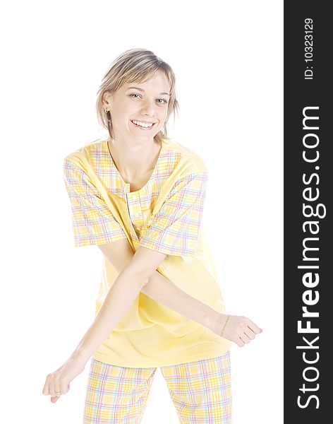 Playful teenager in a yellow pajama isolated over white