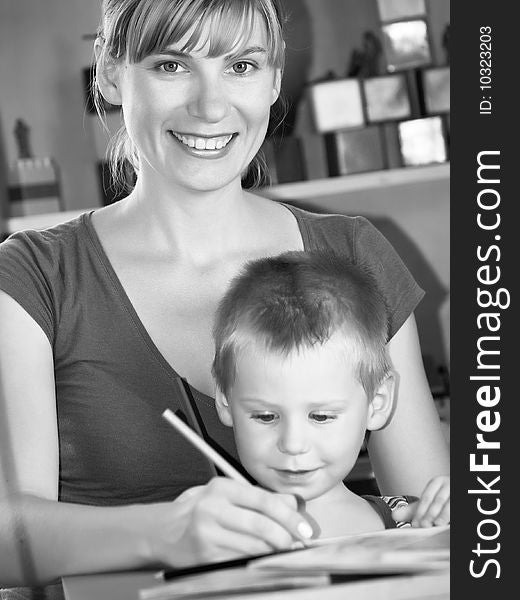 The mum with son is engaged in a children's room. The mum with son is engaged in a children's room