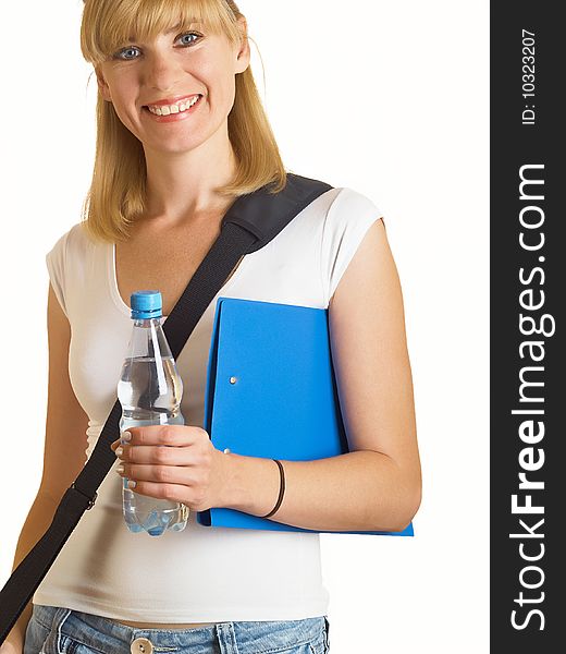 Portrait of a young attractive student, it holds a bottle with water on the white background. Portrait of a young attractive student, it holds a bottle with water on the white background
