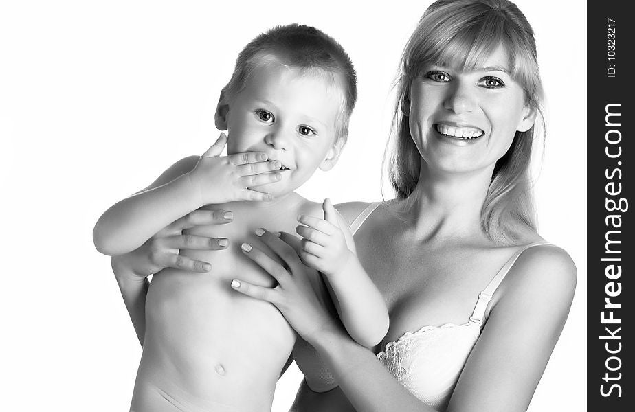 Young mum with the small son on a white background. Black and white. Young mum with the small son on a white background. Black and white