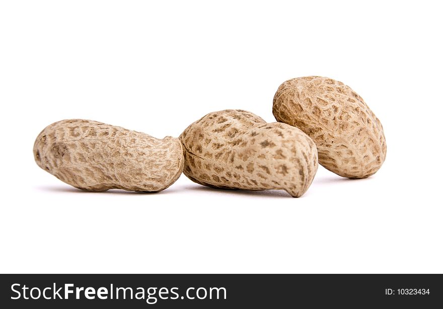 Three peanuts on isolated background