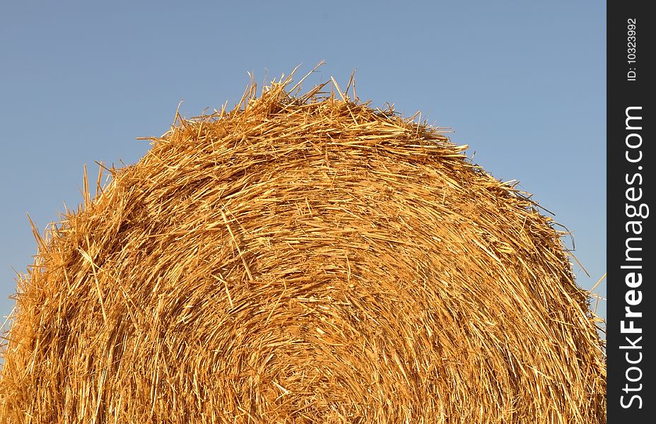 Harvested haystack detail on a wheat-field