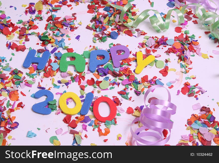 The word 2010 to be used as a backgound with confetti. The word 2010 to be used as a backgound with confetti