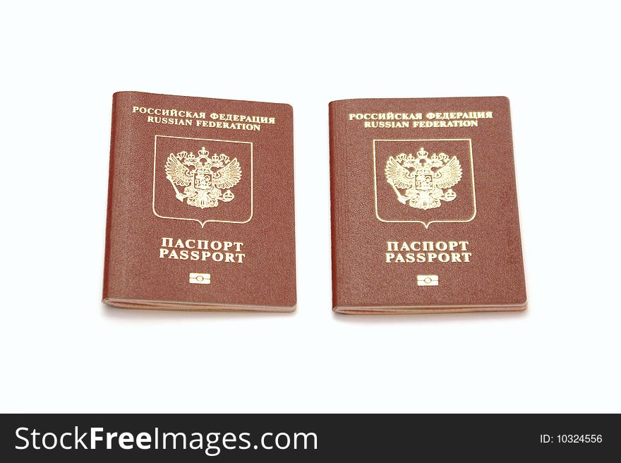 Three passports for travel abroad on a white background are removed by close up