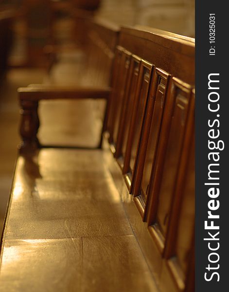 Shallow DOF row of wooden benches in cathedral, Geneva. Shallow DOF row of wooden benches in cathedral, Geneva