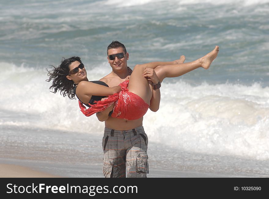 Attractive Lovely Couple On The Beach