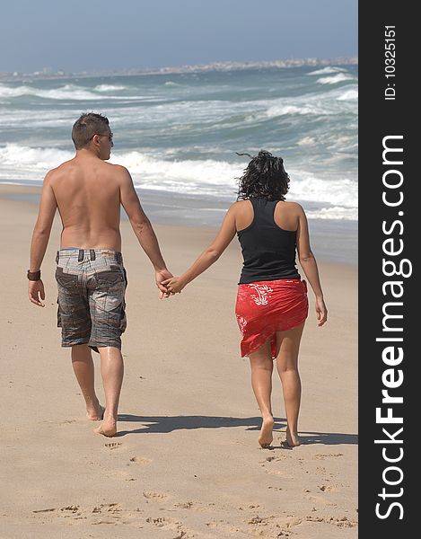 Attractive Lovely Couple On The Beach