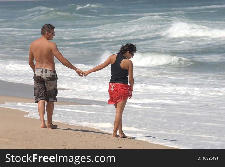 Attractive lovely couple on the beach