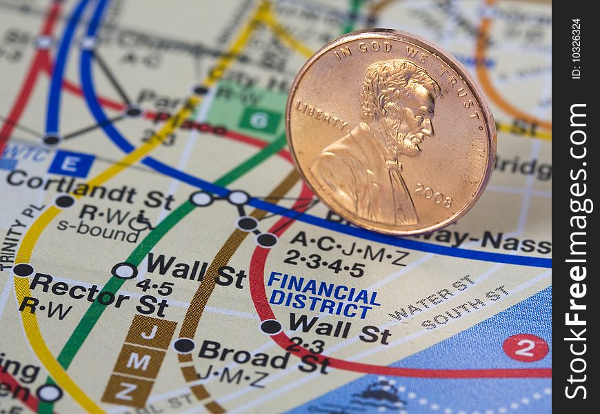 American penny on a subway map representing economy.