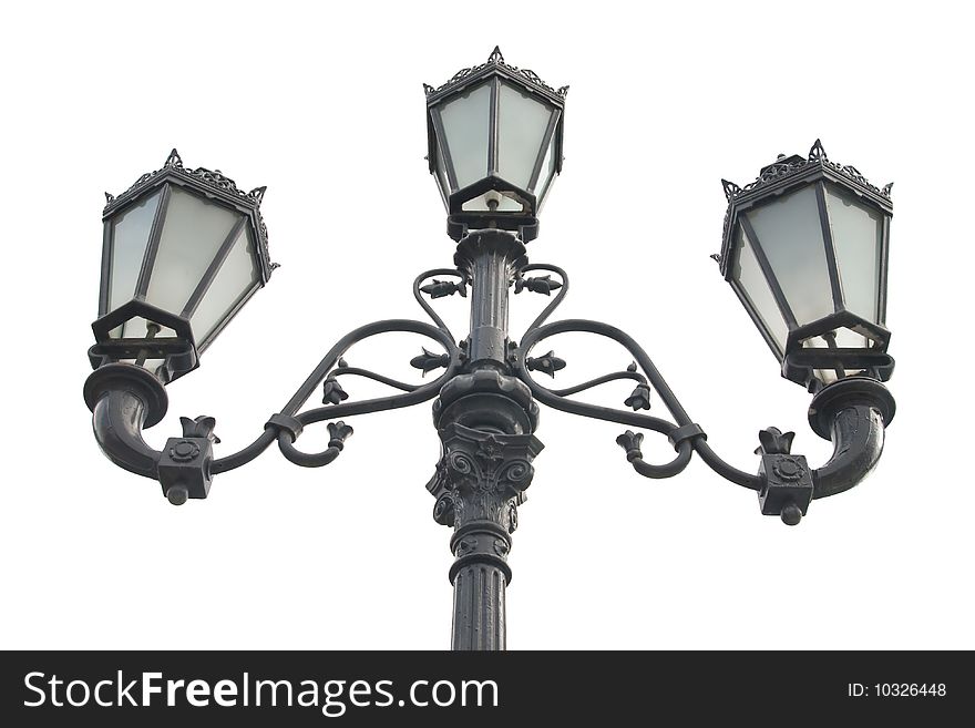 An isolated photo of an old street lamppost. An isolated photo of an old street lamppost