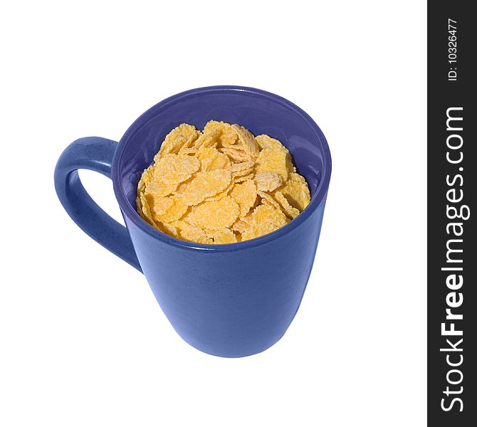 A cup full of cornflakes, view from above. A cup full of cornflakes, view from above